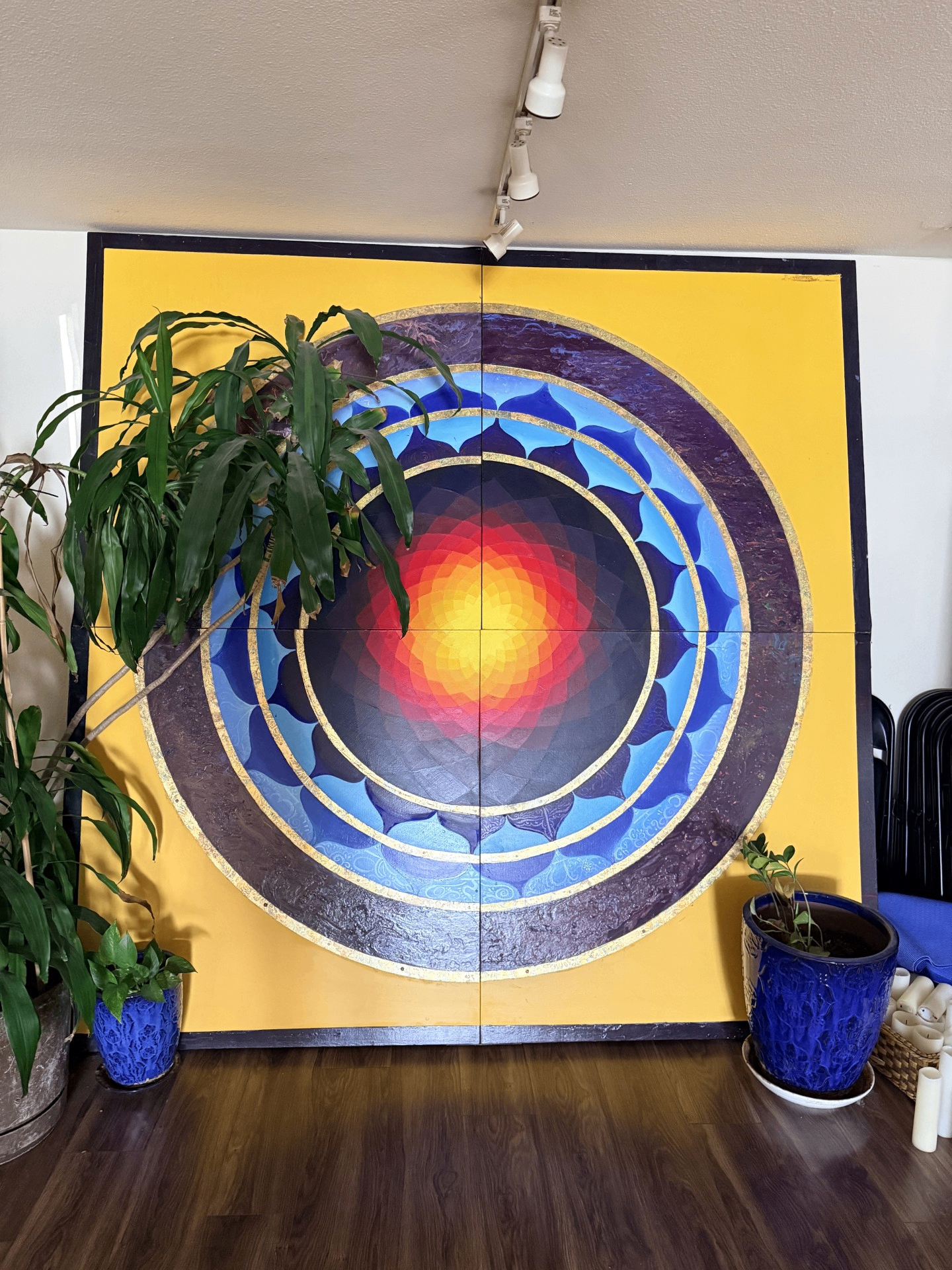 Large colorful mandala mural inside Blue Anjou Yoga Studio