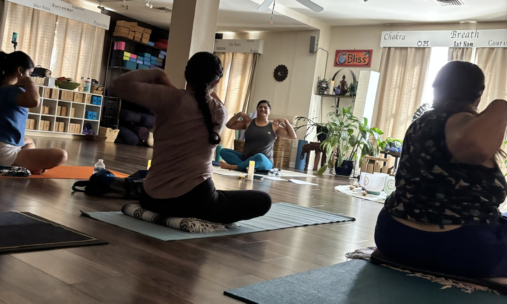 Students gathered for a seated practice inside Blue Anjou Yoga Studio